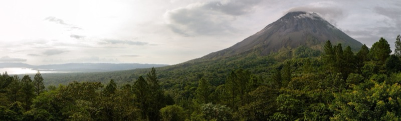 Arenal Volcano above the rainforest, with Lake Arenal on the left, seen from near the Arenal Observatory Lodge