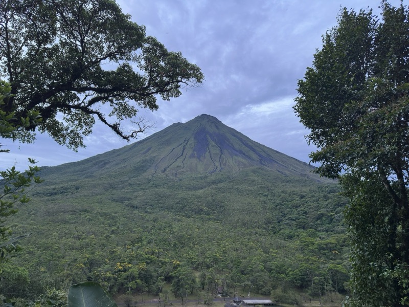 Arenal Volcano seen through the trees in Arenal Volcano National Park